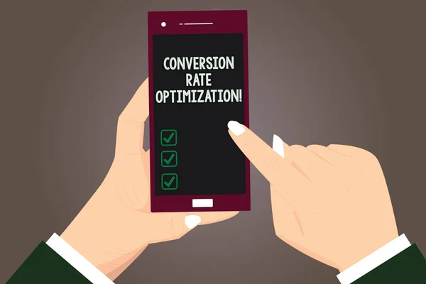 Word writing text Conversion Rate Optimization. Business concept for increasing the percentage of website visitors Hu analysis Hands Holding Pointing Touching Smartphone Blank Color Screen.