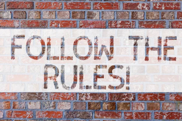 Handwriting text writing Follow The Rules. Concept meaning act in agreement or compliance with obey them Firmly Brick Wall art like Graffiti motivational call written on the wall. — Stock Photo, Image