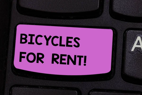 Handwriting text writing Bicycles For Rent. Concept meaning rents bikes for short periods of time usually few hours Keyboard key Intention to create computer message pressing keypad idea.