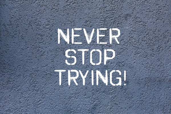 Text sign showing Never Stop Trying. Conceptual photo fight hardest battle inorder reach your goals and dreams Brick Wall art like Graffiti motivational call written on the wall.