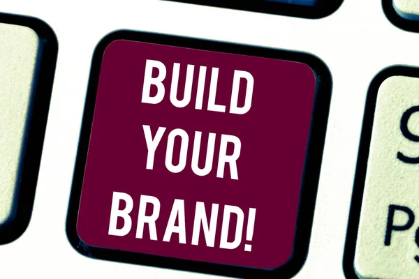 Conceptual hand writing showing Build Your Brand. Business photo text company creates or improves customers knowledge and opinion Keyboard key Intention to create computer message idea. — Stock Photo, Image