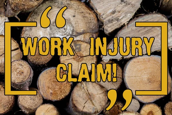 Handwriting text writing Work Injury Claim. Concept meaning insurance providing medical benefits to employees Wooden background vintage wood wild message ideas intentions thoughts.