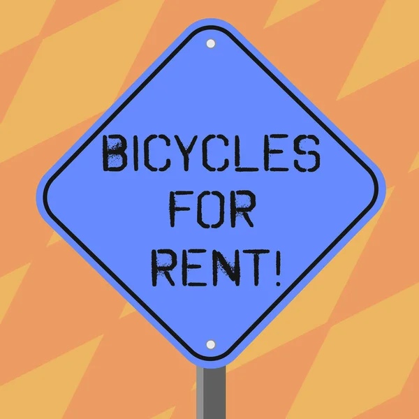 自転車のレンタルを示すテキスト記号。概念的な写真は 1 脚スタンドの写真では通常数時間空白ダイヤモンド形状色道路警告看板の時間の短い期間のためバイクをレンタルします。. — ストック写真
