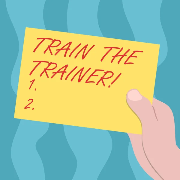 Conceptual hand writing showing Train The Trainer. Business photo text identified to teach mentor or train others attend class Drawn Hu analysis Hand Holding Blank Color Paper Cardboard. — Stock Photo, Image