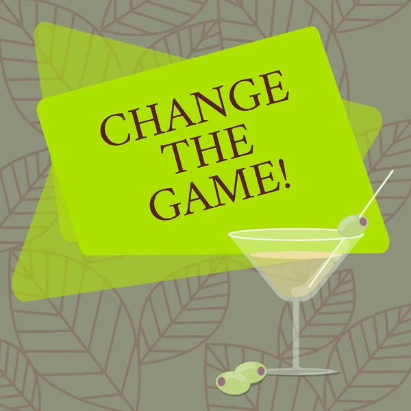 Word writing text Change The Game. Business concept for Make a movement do something different new strategies Filled Cocktail Wine Glass with Olive on the Rim Blank Color Text Space.