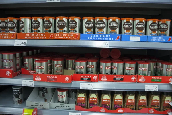 BIRMINGHAM, UK - March 2018 ASDA Coffee in Powder and Granules on Display Shelves. Instant Decaf and Espresso in Container with Lid. Products Arranged in Boxes According to their Brandname. — Stock Photo, Image