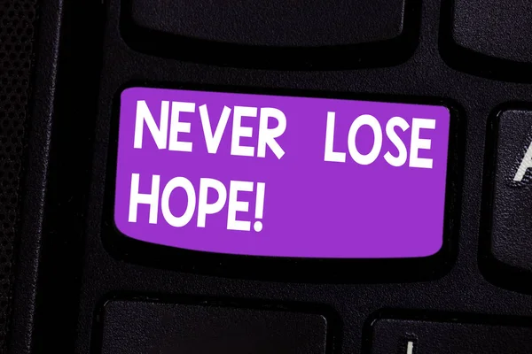 Writing note showing Never Lose Hope. Business photo showcasing Be positive optimistic have motivation to keep going Keyboard key Intention to create computer message pressing keypad idea.