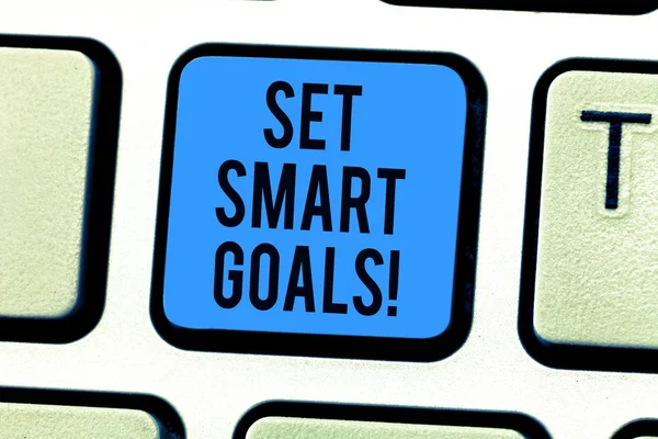 Conceptual hand writing showing Set Smart Goals. Business photo text Establish achievable objectives Make good business plans Keyboard key Intention to create computer message idea.