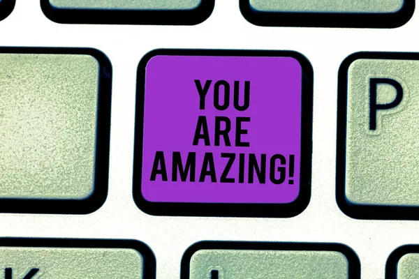 Text sign showing You Are Amazing. Conceptual photo To have a great opinion about someone Admiration Wonder Keyboard key Intention to create computer message pressing keypad idea.