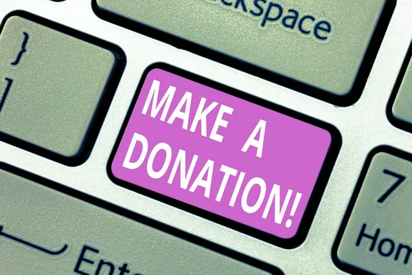 Text sign showing Make A Donation. Conceptual photo Donate giving things not used any more to needed showing Keyboard key Intention to create computer message pressing keypad idea.