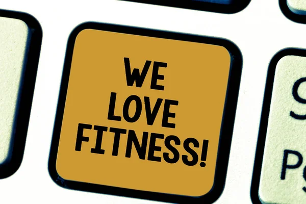Word writing text We Love Fitness. Business concept for Having affection for sport exercises good healthy diet Keyboard key Intention to create computer message pressing keypad idea.