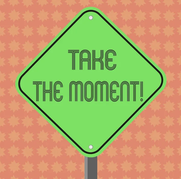 Writing note showing Take The Moment. Business photo showcasing Seize the day and opportunity be happy optimistic positive Diamond Shape Color Road Warning Signage with One Leg Stand. — Stock Photo, Image