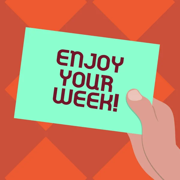 Handwriting text writing Enjoy Your Week. Concept meaning Best wishes for the start of weekdays have great days Drawn Hu analysis Hand Holding Presenting Blank Color Paper Cardboard photo.