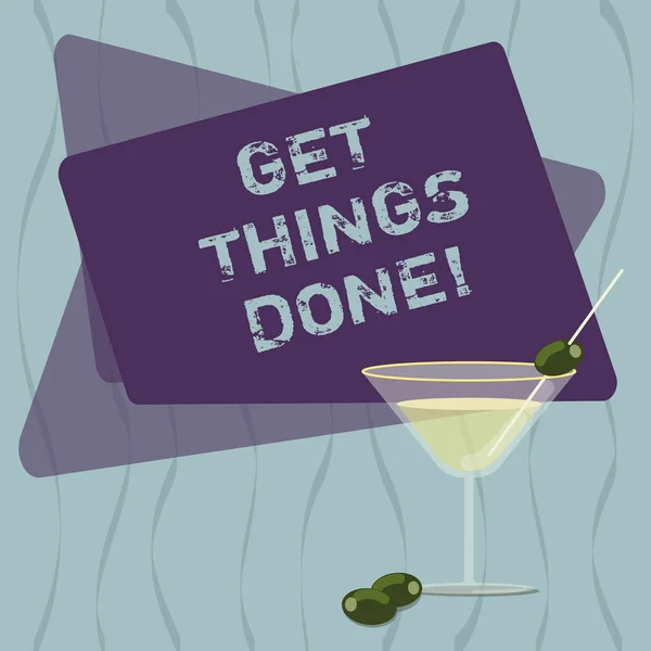 Conceptual hand writing showing Get Things Done. Business photo text To be in charge of do something leader leadership action Filled Cocktail Wine Glass with Olive on the Rim Text Space.