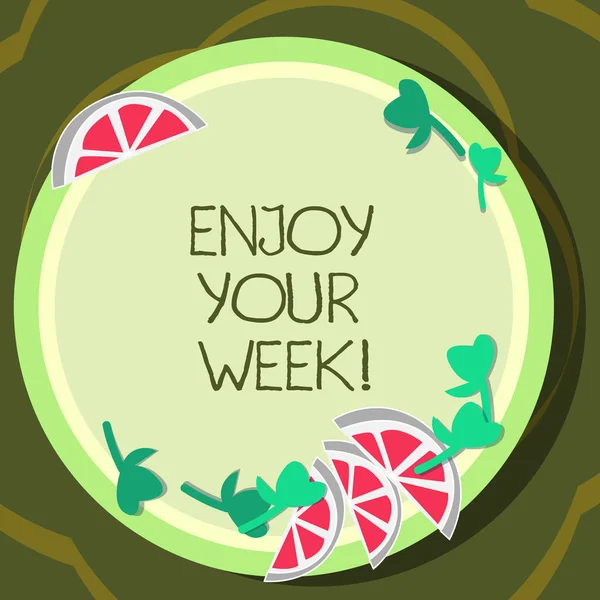 Conceptual hand writing showing Enjoy Your Week. Business photo showcasing Best wishes for the start of weekdays have great days Cutouts of Sliced Lime Wedge and Herb Leaves on Color Plate.
