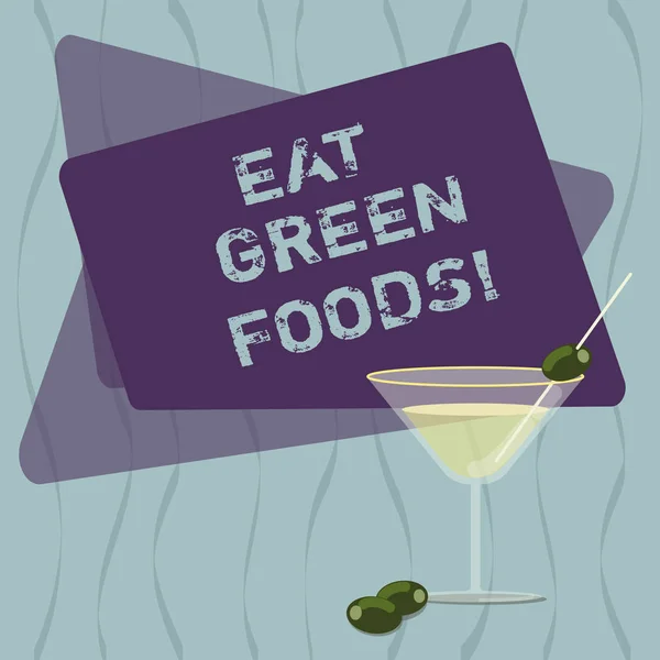 Conceptual hand writing showing Eat Green Foods. Business photo text Eating more vegetables healthy diet vegetarian veggie demonstrating Filled Cocktail Wine Glass with Olive on the Rim Text Space. — 图库照片