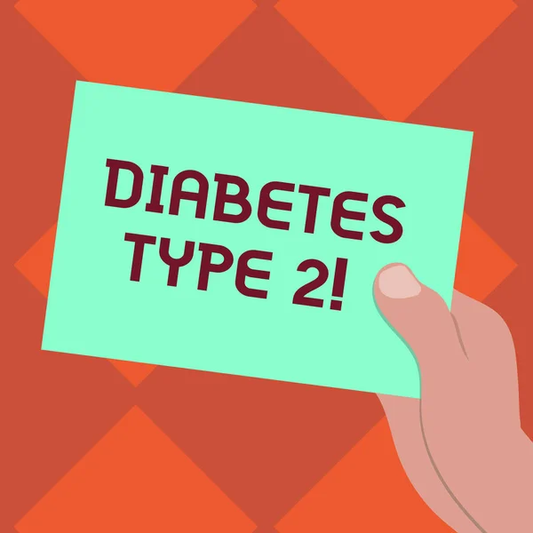 Handwriting text writing Diabetes Type 2. Concept meaning condition which body does not use insulin properly Drawn Hu analysis Hand Holding Presenting Blank Color Paper Cardboard photo.