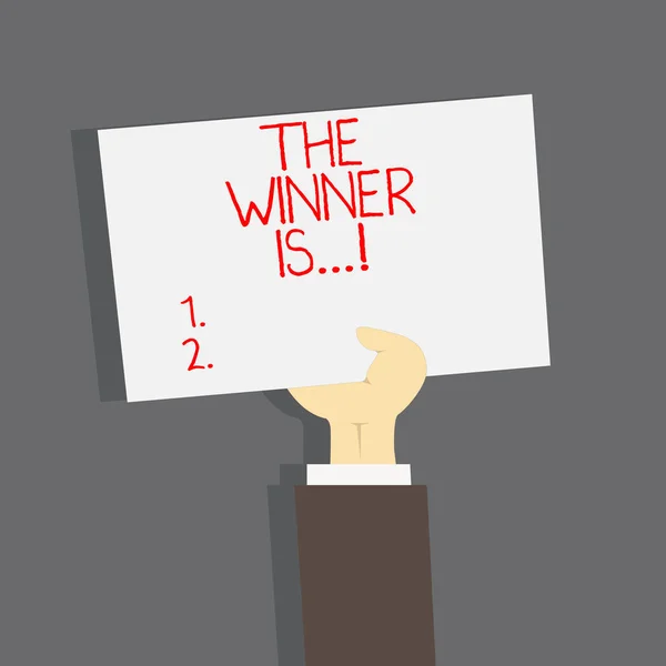 Konceptuella hand skriva visar The vinnaren är. Företag foto text tillkännage som vann tävling seger i en tävling. — Stockfoto