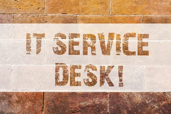 Text sign showing It Service Desk. Conceptual photo Technological support online assistance help center Brick Wall art like Graffiti motivational call written on the wall.