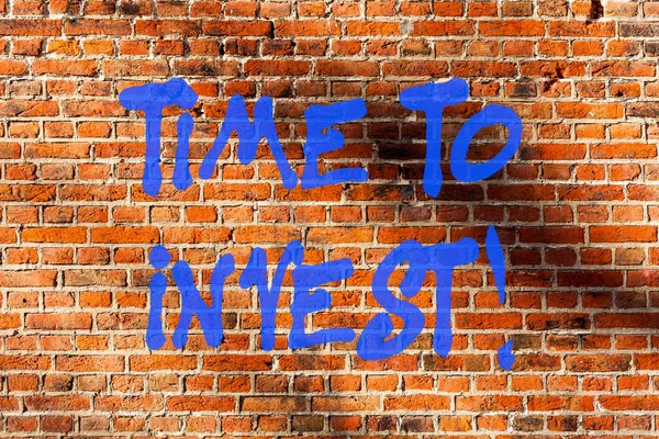 Conceptual hand writing showing Time To Invest. Business photo text Creation of capital capable of producing other goods Brick Wall art like Graffiti motivational call written on the wall.