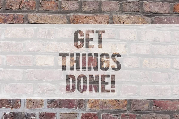 Writing note showing Get Things Done. Business photo showcasing To be in charge of do something leader leadership action Brick Wall art like Graffiti motivational call written on the wall.