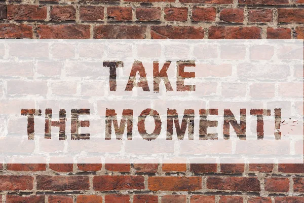 Handwriting text writing Take The Moment. Concept meaning Seize the day and opportunity be happy optimistic positive Brick Wall art like Graffiti motivational call written on the wall. — Stock Photo, Image