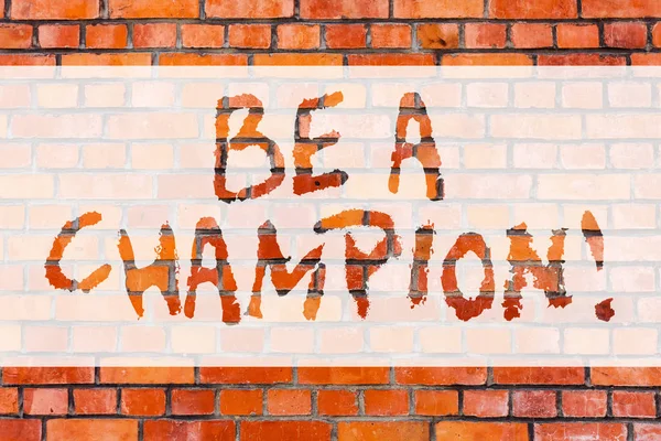 Writing note showing Be A Champion. Business photo showcasing Triumph in a competition sport the winner of a contest Brick Wall art like Graffiti motivational call written on the wall.