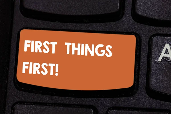 Text sign showing First Things First. Conceptual photo important matters should dealt with before other things Keyboard key Intention to create computer message pressing keypad idea.