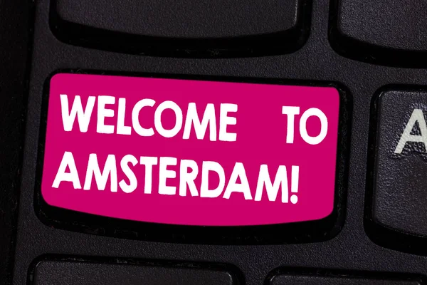 Text sign showing Welcome To Amsterdam. Conceptual photo Greeting someone visits the capital city of Netherlands Keyboard key Intention to create computer message pressing keypad idea.