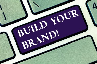 Kavramsal el Build Your marka gösterilen yazma. İş fotoğraf metin şirket oluşturur veya müşteriler bilgi ve görüş klavye tuşu bilgisayar ileti fikir oluşturmak için niyet geliştirir.