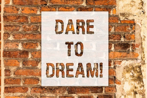 Conceptual hand writing showing Dare To Dream. Business photo text Do not be afraid of have great ambitions goals objectives Brick Wall art like Graffiti motivational call written on the wall. — Stock Photo, Image