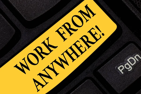 Text sign showing Work From Anywhere. Conceptual photo self employed and hired to work for different companies Keyboard key Intention to create computer message pressing keypad idea.