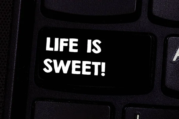 Conceptual hand writing showing Life Is Sweet. Business photo text Happiness seeing the good side of events Motivation Inspire Keyboard key Intention to create computer message idea.