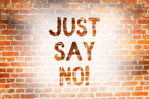 Writing note showing Just Say No. Business photo showcasing Do not be afraid of giving negative answers to some things Brick Wall art like Graffiti motivational call written on the wall.