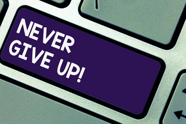 Writing note showingNever Give Up. Business photo showcasing Keep trying until you succeed follow your dreams goals Keyboard key Intention to create computer message pressing keypad idea.