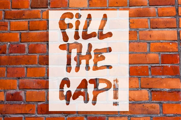 Handwriting text writing Fill The Gap. Concept meaning Put he missing part in its right place Solution to the puzzle Brick Wall art like Graffiti motivational call written on the wall.