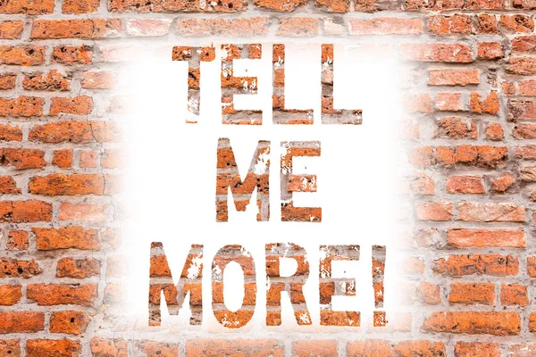 Text sign showing Tell Me More. Conceptual photo A call to start a conversation Sharing more knowledge Brick Wall art like Graffiti motivational call written on the wall.