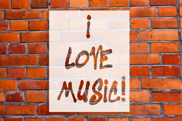 Rukopis textu, psaní, I Love Music. Pojetí znamená, že náklonnost k dobré zvuky lyrická zpěváci hudebníci cihlová zeď umění jako motivační volání Graffiti na zdi. — Stock fotografie