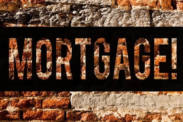 Word writing text Mortgage. Business concept for Conditional right of property to lender as warranty from loan Brick Wall art like Graffiti motivational call written on the wall.