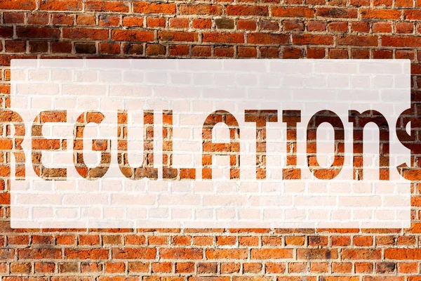 Text sign showing Regulations. Conceptual photo Rules Laws Corporate Standards Policies Security Statements Brick Wall art like Graffiti motivational call written on the wall. — Stock Photo, Image