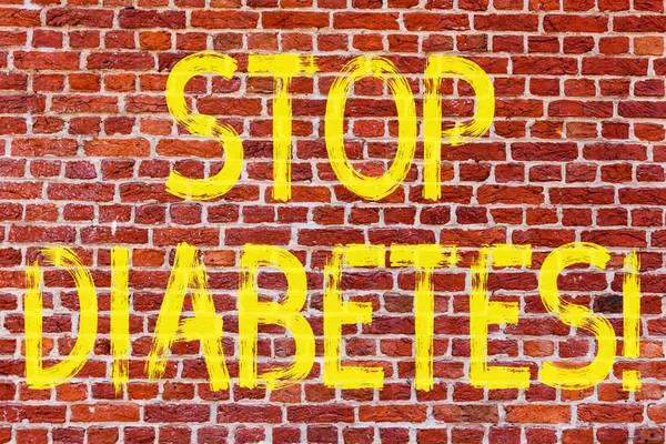 Writing note showing Stop Diabetes. Business photo showcasing Take care of your Sugar Levels Healthy Diet Nutrition Habits Brick Wall art like Graffiti motivational call written on the wall.