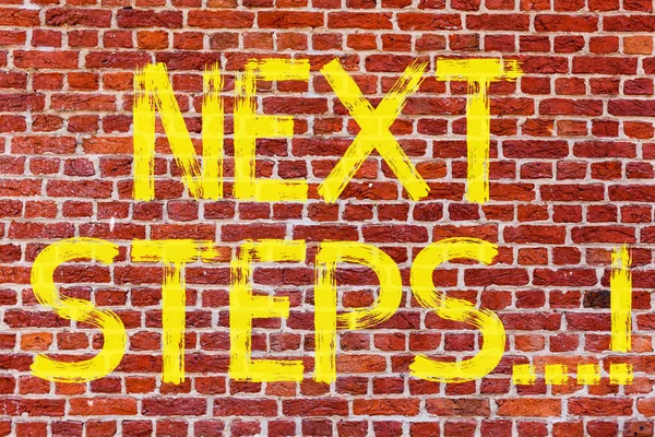 Writing note showing Next Steps. Business photo showcasing Following Moves Strategy Plan Give Directions Guideline Brick Wall art like Graffiti motivational call written on the wall.