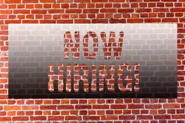 Word writing text Now Hiring. Business concept for Workforce Wanted Employees Recruitment Brick Wall art like Graffiti motivational call written on the wall.