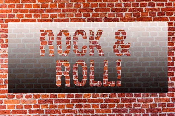 Word writing text Rock And Roll. Business concept for Musical Genre Type of popular dance music Heavy Beat Sound Brick Wall art like Graffiti motivational call written on the wall.