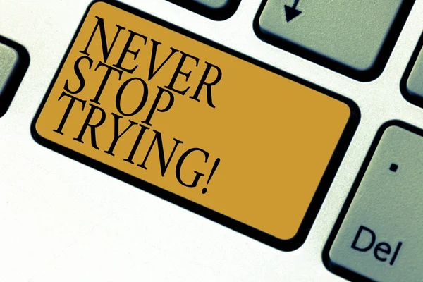 Text sign showing Never Stop Trying. Conceptual photo go on do not give up Self confidence Keyboard key Intention to create computer message pressing keypad idea.