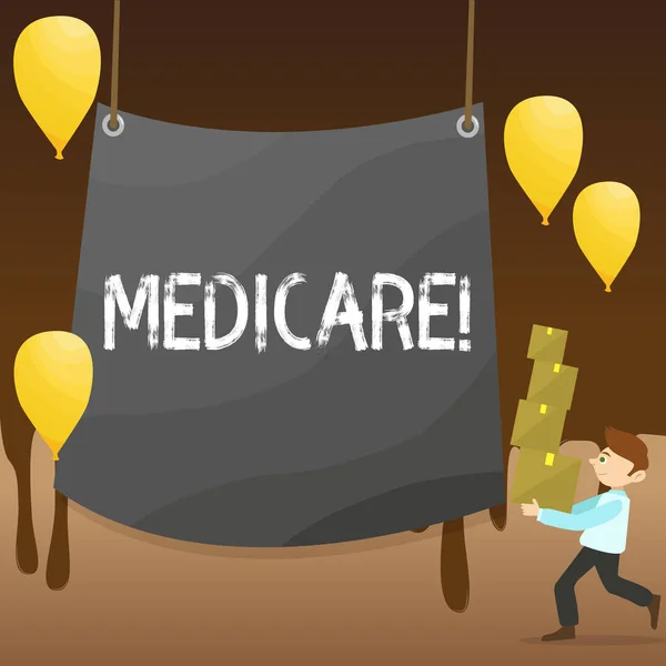 Text sign showing Medicare. Conceptual photo Federal health insurance for showing above 65 or with disabilities Man Carrying Pile of Boxes with Blank Tarpaulin in the Center and Balloons.