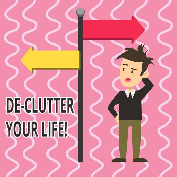 Text sign showing De Clutter Your Life. Conceptual photo remove unnecessary items untidy or overcrowded places Man Confused with the Road Sign Arrow Pointing to Opposite Side Direction. — 图库照片