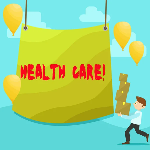 Text sign showing Health Care. Conceptual photo Medical Maintenance Improvement of Physical Mental conditions Man Carrying Pile of Boxes with Blank Tarpaulin in the Center and Balloons.
