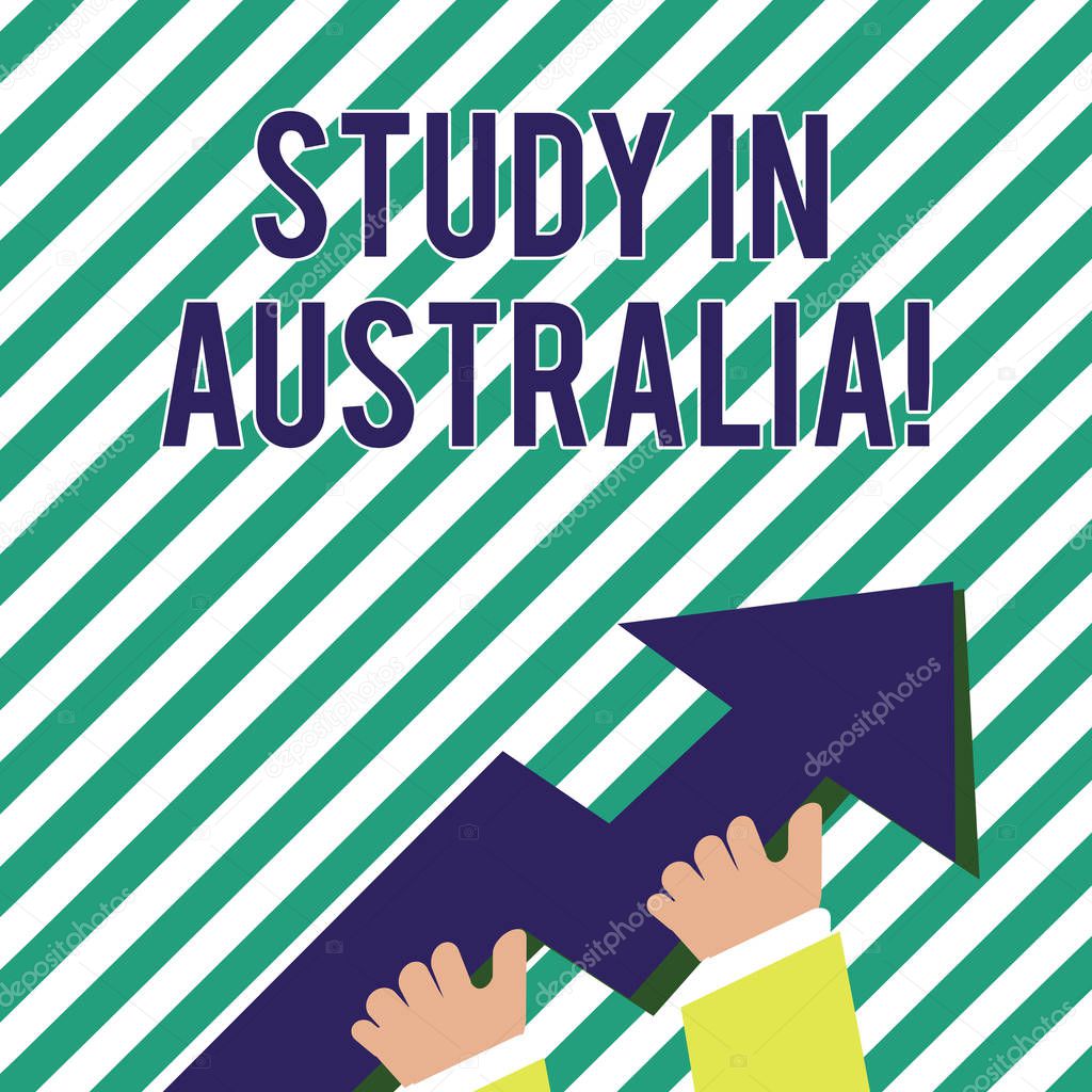 Handwriting text Study In Australia. Concept meaning Graduate from oversea universities great opportunity photo of Hand Holding Colorful Huge 3D Arrow Pointing and Going Up.
