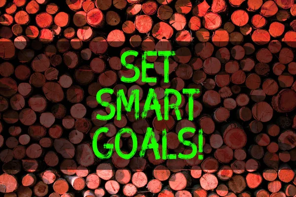 Conceptual hand writing showing Set Smart Goals. Business photo showcasing list to clarify your ideas focus efforts use time wisely Wooden background vintage wood wild message ideas thoughts.